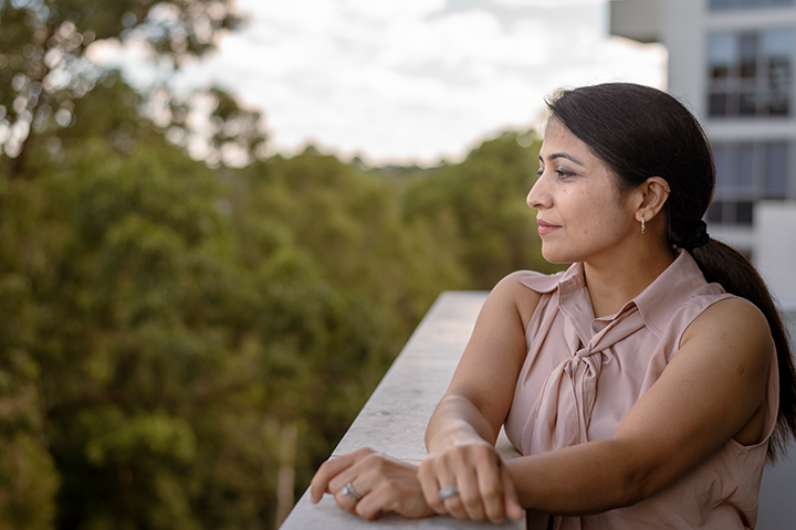 Hopeful woman savoring peaceful moment outdoors on patio