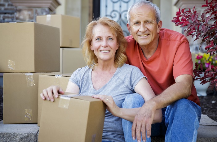 Couple with moving boxes image
