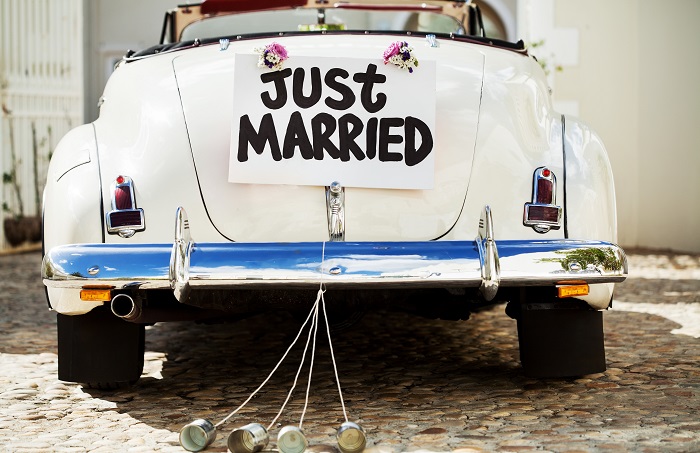 Just married couple in vintage car