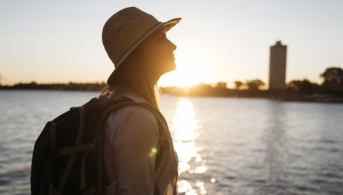 Woman looking onto sunset image
