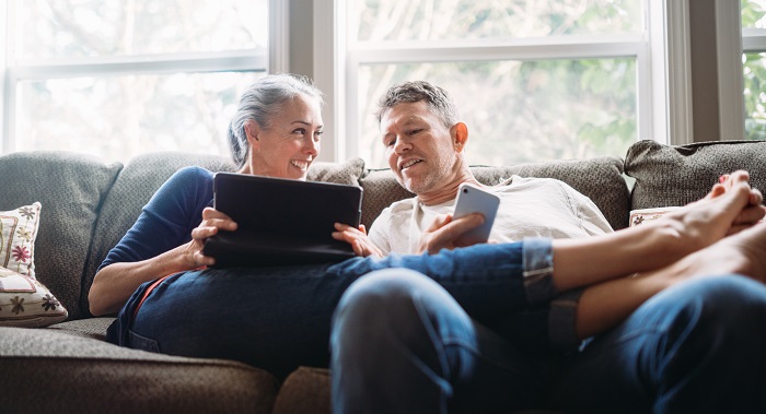 Mature Couple Relaxing with Tablet
