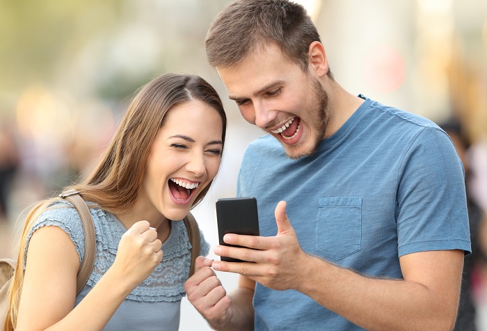 Couple getting good news on the phone