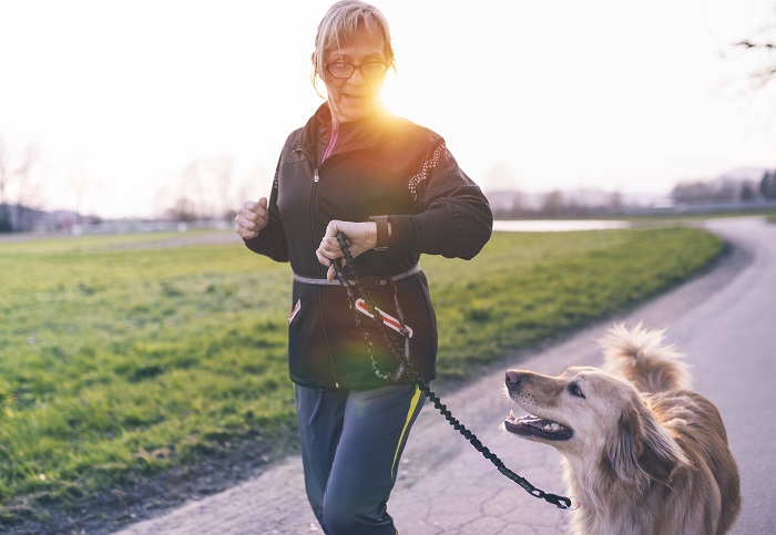 Woman jogging with dog