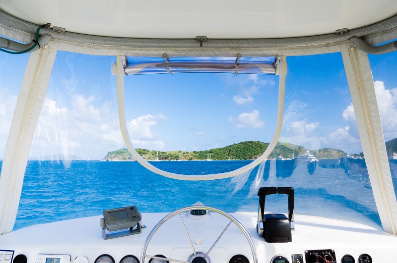 View from a motor boat across tropical waters to an island