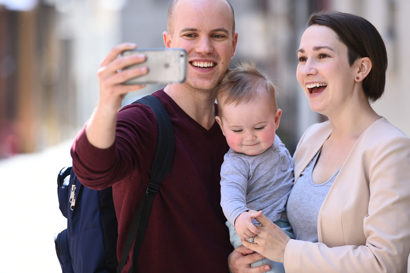 Young family taking a selfie